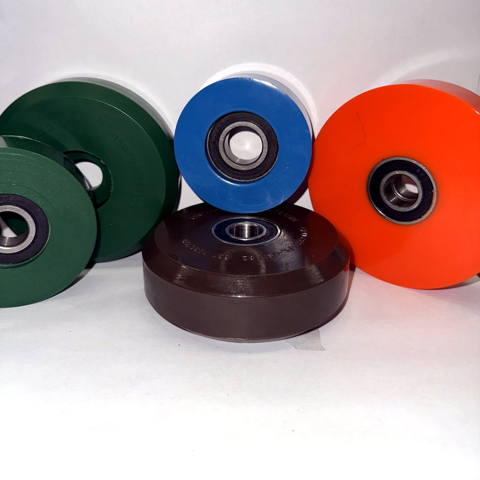 AeroPorter urethane wheels in brown, blue, orange and green