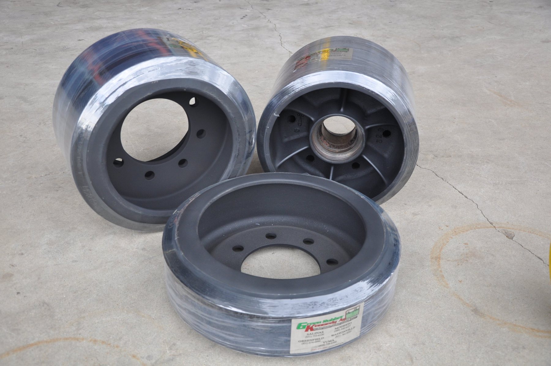 Three rebuilt bogie wheels at Green Rubber Kennedy Ag